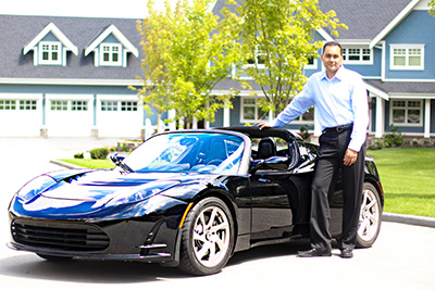 Sam with his Tesla